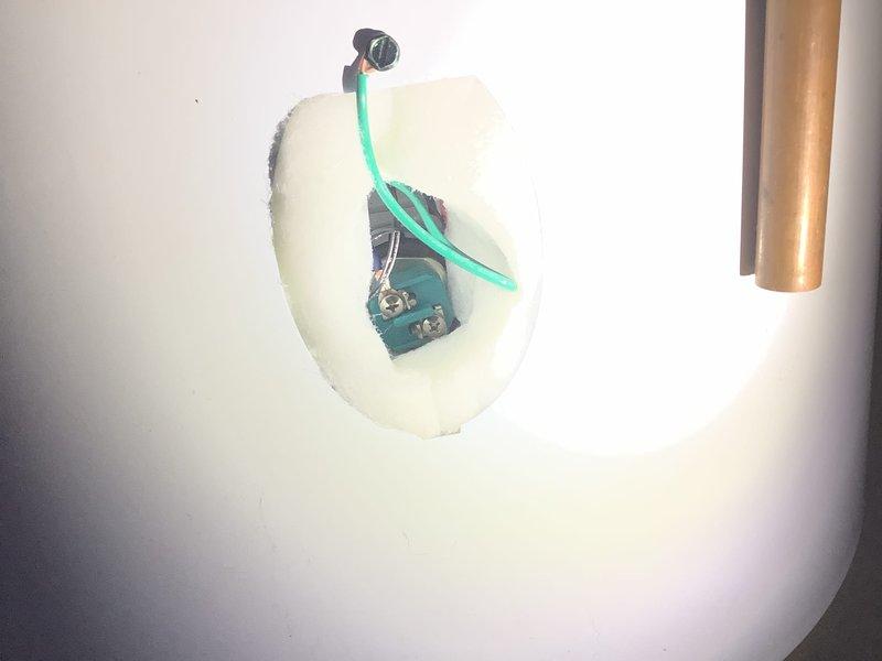 Responded to service call for water heater with reported lower element error. Upon arrival, confirmed unit was producing hot water. Performed diagnostic testing using digital multimeter on lower heating element assembly, obtaining voltage reading of 12.59V. Accessed electrical junction box and inspected wiring connections and wire nuts for proper installation. Documented existing conditions with photographs showing electrical components and testing procedures for service records.