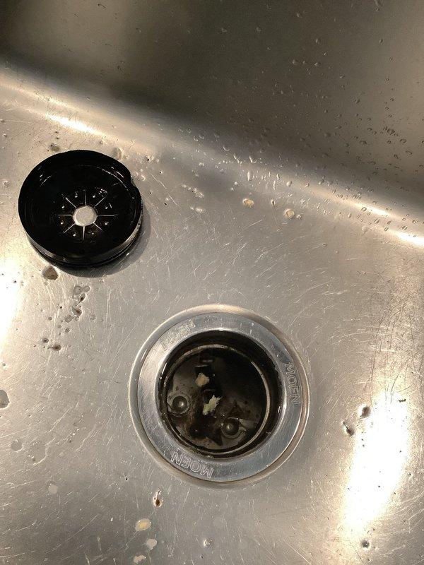 Completed installation of new 1/2 HP garbage disposal unit to replace non-functioning unit. Addressed kitchen sink clog issue and installed upgraded disposal model with improved grinding capabilities. All connections secured, system tested and verified operational.