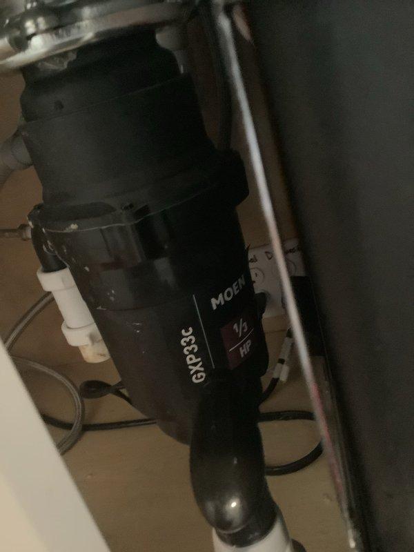 Completed installation of new 1/2 HP garbage disposal unit to replace non-functioning unit. Addressed kitchen sink clog issue and installed upgraded disposal model with improved grinding capabilities. All connections secured, system tested and verified operational.