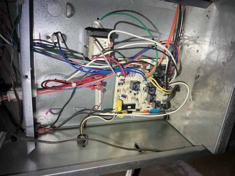 Completed CPM air conditioning inspection at residential property. Documented HVAC system electrical control compartment and circuit board assembly with photographs for equipment records as requested. Inspected control board components including relays, capacitors, resistors, and integrated circuits; verified wiring connections across multiple circuits with proper color-coded conductors and grounding. All electrical components and connections found in serviceable condition with normal wear consistent with system age.