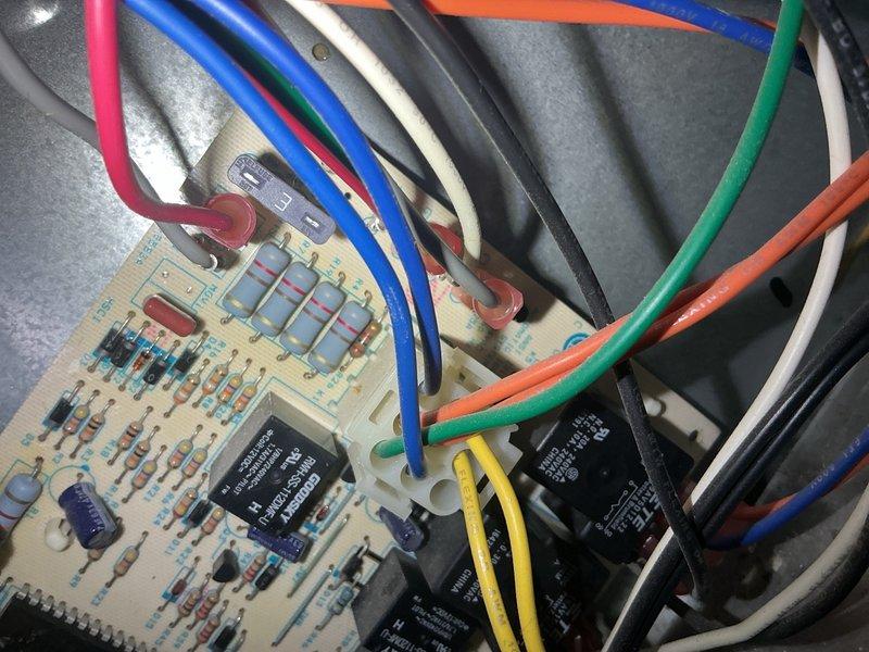 Completed CPM air conditioning inspection at residential property. Documented HVAC system electrical control compartment and circuit board assembly with photographs for equipment records as requested. Inspected control board components including relays, capacitors, resistors, and integrated circuits; verified wiring connections across multiple circuits with proper color-coded conductors and grounding. All electrical components and connections found in serviceable condition with normal wear consistent with system age.
