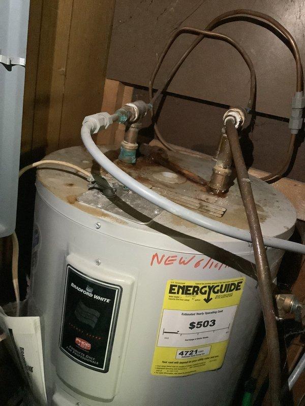 Replaced 15-year-old 30-gallon electric water heater with new Bradford White unit due to leaking pipe at original water heater. Constructed wooden platform in closet location to properly support new installation, as existing flooring in original location required repair. Installed compression fittings and connected all water supply lines and electrical connections to restore hot water service.
