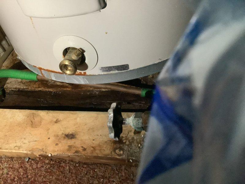 Replaced 15-year-old 30-gallon electric water heater with new Bradford White unit due to leaking pipe at original water heater. Constructed wooden platform in closet location to properly support new installation, as existing flooring in original location required repair. Installed compression fittings and connected all water supply lines and electrical connections to restore hot water service.