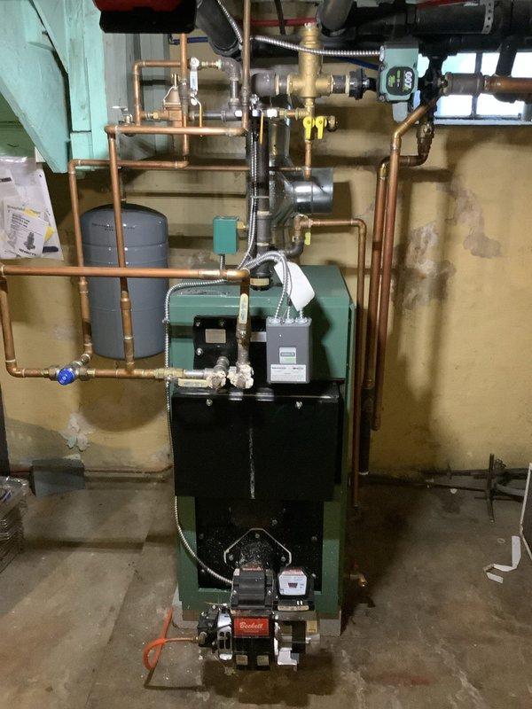 Completed comprehensive CPM oil heating inspection and cleaning service on New Yorker oil boiler system. Performed thorough cleaning of burner assembly, inspected all system components including circulator pump, expansion tank, and hydronic piping network. Verified proper operation of all safety controls, checked system pressures, and confirmed efficient combustion performance. All components found to be functioning within normal parameters with no immediate service needs identified.