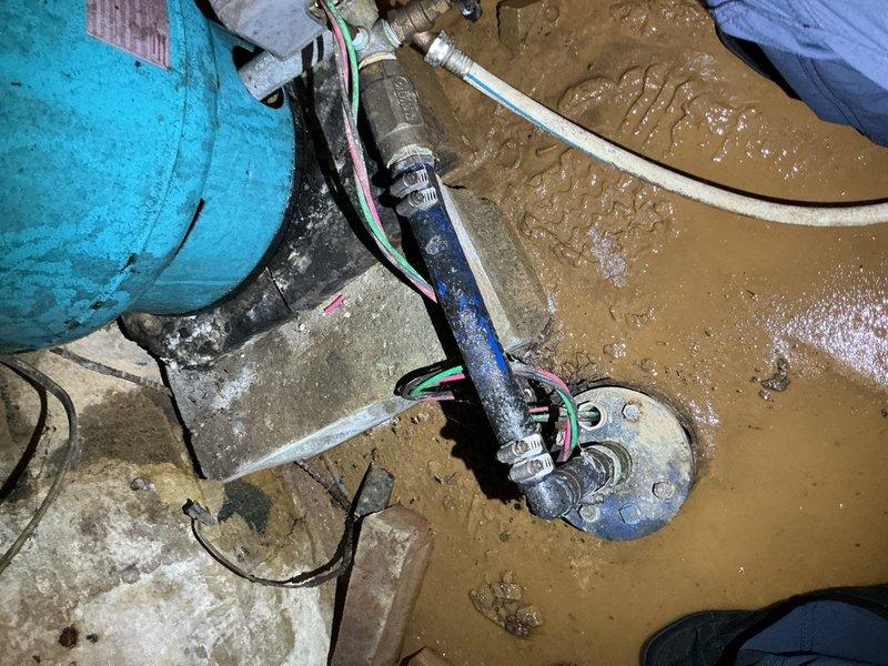 Responded to low water pressure complaint at residential well system. Upon arrival, found significant water accumulation in basement/crawlspace area requiring immediate attention. Performed diagnostic testing on well pump system using multimeter to check electrical components and capacitor functionality. Assessed submersible pump operation and verified proper electrical connections. Deployed pumping equipment to address standing water in affected area. Tested system voltage and capacitance to ensure well pump electrical components were operating within manufacturer specifications.