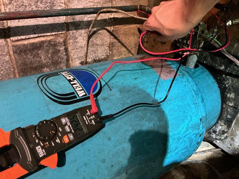 Responded to low water pressure complaint at residential well system. Upon arrival, found significant water accumulation in basement/crawlspace area requiring immediate attention. Performed diagnostic testing on well pump system using multimeter to check electrical components and capacitor functionality. Assessed submersible pump operation and verified proper electrical connections. Deployed pumping equipment to address standing water in affected area. Tested system voltage and capacitance to ensure well pump electrical components were operating within manufacturer specifications.