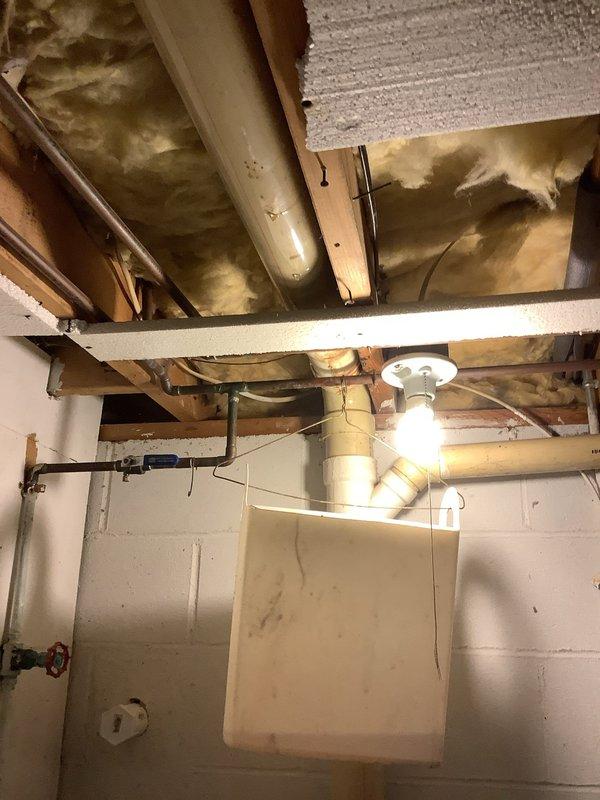Responded to emergency call for toilet leaking into basement. Upon arrival, confirmed active water leak requiring immediate attention and temporary containment. Removed existing failed toilet and installed customer-supplied replacement unit. Ensured proper sealing, secure mounting, and verified all connections were leak-free. Tested flush operation and confirmed no water intrusion to basement area below. 

Provided estimate for future installation of comfort height elongated bowl toilet with option for pressure-assisted model to accommodate accessibility needs. Also provided separate estimate for relocating washer and dryer hookups to third bedroom, including necessary plumbing modifications for water supply lines, drain connections, and venting requirements.