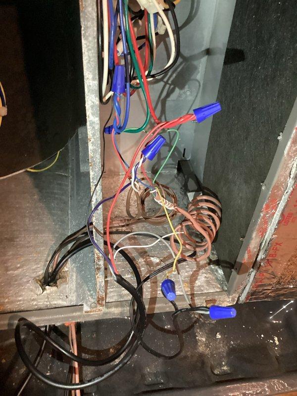 Responded to no-cooling complaint on Lennox AC system installed in September 2019. Upon arrival, verified thermostat was calling for cooling with setpoint at 71°F and indoor temperature reading 74°F in cooling mode. Inspected indoor air handler wiring and heat strip connections, confirmed all electrical connections secure with proper wire nutting. Customer had already replaced filter prior to service call. System was operational but failing to provide adequate cooling; performed diagnostic evaluation of thermostat operation and electrical components to identify cause of cooling failure.
