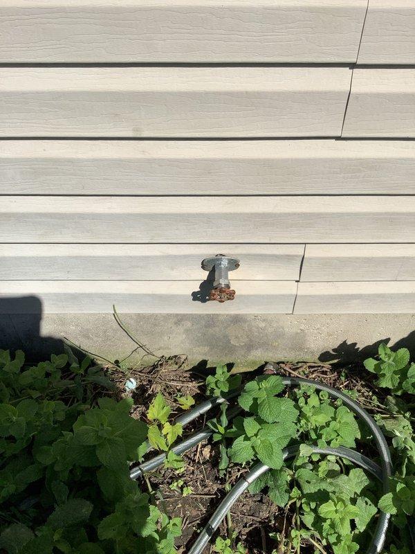Responded to outdoor faucet that would not shut off completely, causing continuous leak. Inspected hose bib and surrounding plumbing system, documenting existing conditions with photos. Presented customer with repair options including full faucet replacement and installation of an isolation valve for improved water control and future maintenance access.