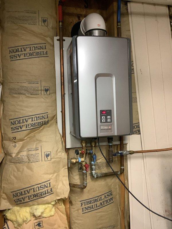 Responded to service call for no hot water issue affecting seven Kohler shower heads while all other fixtures had hot water. Inspected Rinnai tankless gas water heater installation and verified unit operation, connections, and temperature settings. Diagnosed and resolved flow rate issue preventing adequate hot water delivery to multiple shower head system, restoring full hot water function to all shower fixtures.