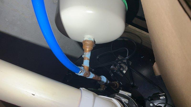 Responded to gas leak on newly installed direct vent gas water heater. Upon arrival, confirmed gas supply was shut off for safety. Inspected installation and identified improper blue plastic tubing used on gas supply line from street connection. Explained to homeowner that plastic tubing is not code-compliant for natural gas applications and poses serious safety hazard. Documented unsafe installation with photos showing the flexible plastic line connected to water heater and surrounding mechanical components. Recommended immediate replacement of plastic gas line with approved black iron pipe or corrugated stainless steel tubing (CSST) by licensed professional to meet code requirements and ensure safe operation.