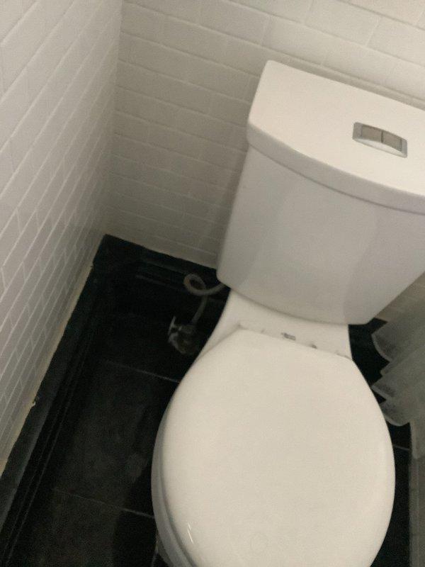 Responded to service call for toilet leaking into basement when flushed. Upon arrival, water supply had been shut off to prevent further damage. Inspected two-piece toilet installation, tank components, and flush mechanism to identify source of leak. Completed necessary repairs to resolve leak issue and restore proper toilet function without water entering basement area.