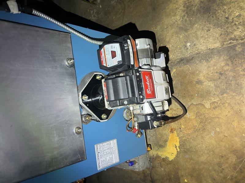Completed comprehensive oil cleaning and service on Thermo Dynamics oil boiler originally installed in December 2016. Replaced .85/80B nozzle and 1A-25A oil filter, inspected fuel pump assembly and hydraulic components, and verified all system connections and electrical terminals were secure and functioning properly. System tested and left in full operational condition.