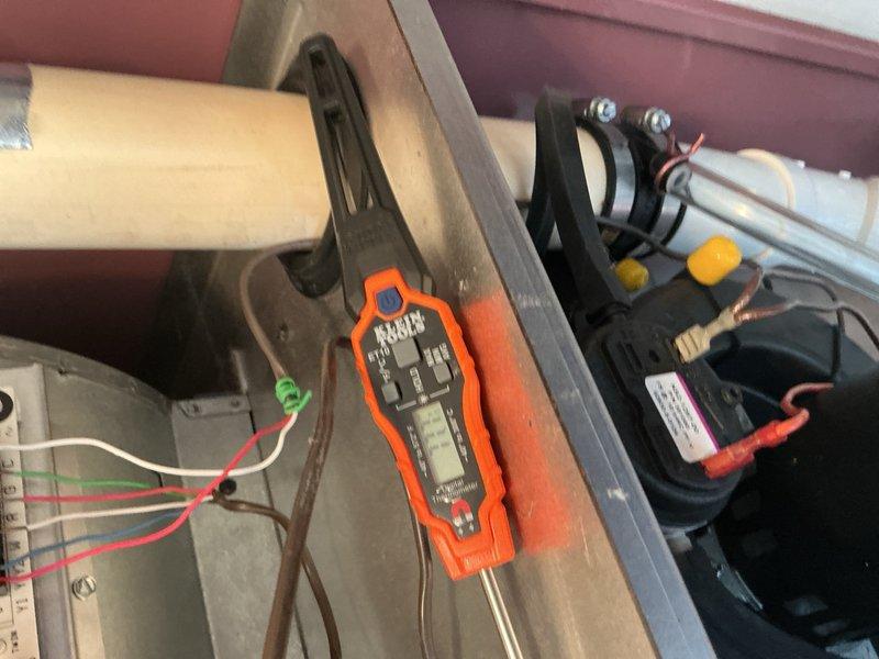 Responded to no-heat call on Thermo Pride LP furnace installed October 2024. Upon arrival, found unit completely non-operational with house temperature at 66°F. Performed diagnostic testing using multimeter to check electrical components including capacitor and control circuits. Identified blockage and debris accumulation in condensate drain tubes preventing proper operation. Cleared obstructions from plastic drain lines to restore drainage function. Addressed previously noted issue with water leaking from inducer/exhaust connection that was documented during prior AC maintenance but not completed. Applied high-temperature silicone sealant to seal connection between inducer motor and exhaust piping to prevent moisture intrusion. Verified all electrical connections, tested system operation, and confirmed unit restored to proper heating function with adequate airflow through floor registers.