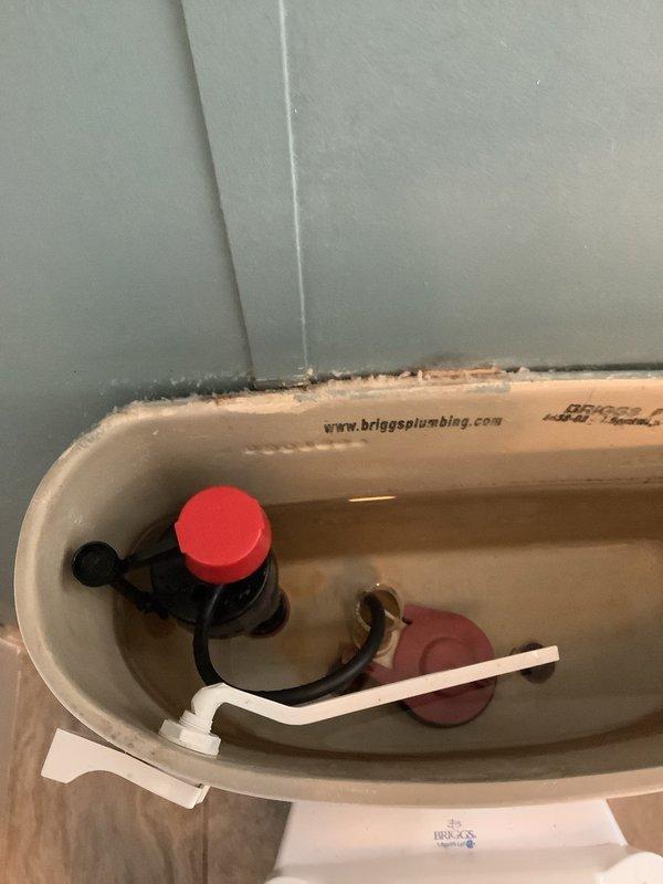Responded to service call for reported toilet float issue. Upon inspection, examined all internal tank components including fill valve with functional red cap, flush valve assembly with intact flapper seal, and overflow tube. All mechanisms were found to be in proper working condition with normal water levels and no signs of malfunction or component failure. Determined that existing float and fill valve system did not require replacement at this time.