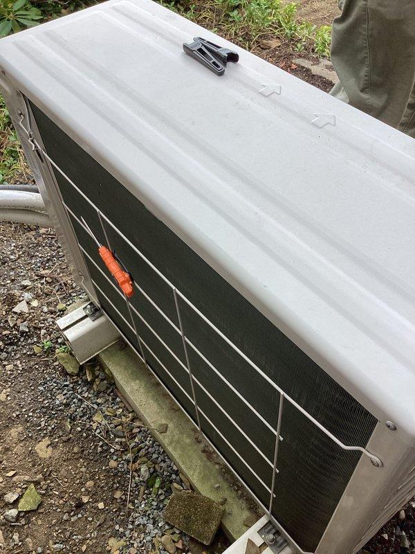 Completed CPM oil heating inspection at property with no existing oil equipment found on file. Documented HVAC equipment with photographs showing Samsung heat pump system installed in August 2021, positioned on exterior concrete pad with refrigerant lines running along foundation wall. Heat pump evaluation scheduled as separate service to verify system operation and performance.