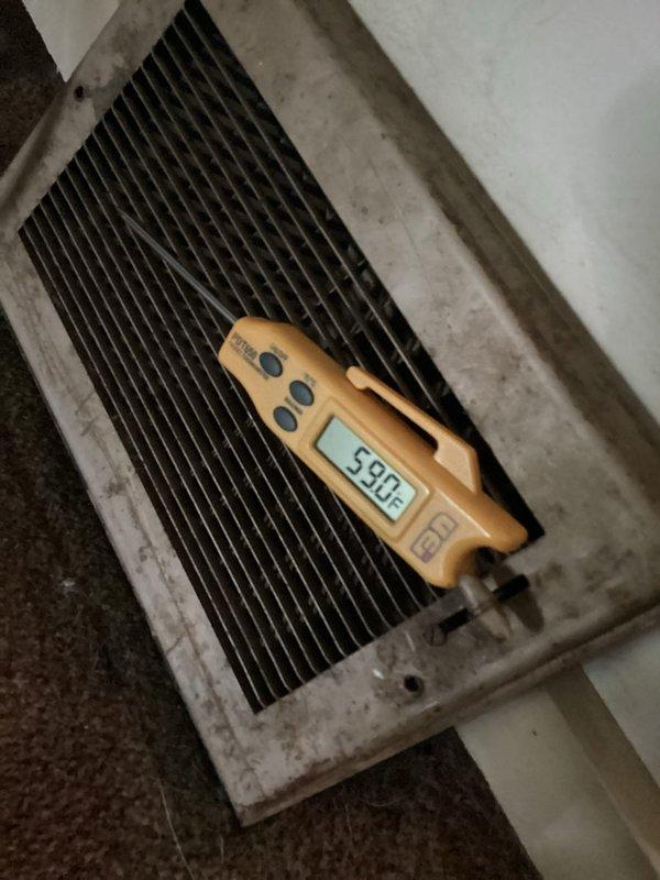 Removed existing water heater from basement location. Drained remaining water from unit prior to removal and safely transported water heater using appliance hand truck with two-person assistance due to weight and access constraints.