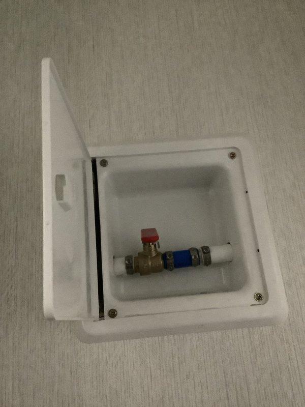 Responded to emergency call for leaking main water shut-off valve. Upon arrival, confirmed water was already shut off at exterior main to control active leak. Replaced faulty main shut-off valve assembly with new brass ball valve with red handle. Installed valve within recessed wall access panel box with proper gasket seal and secured with white PVC connections on both sides. Tested valve operation, confirmed no leaks, and restored water service to property.
