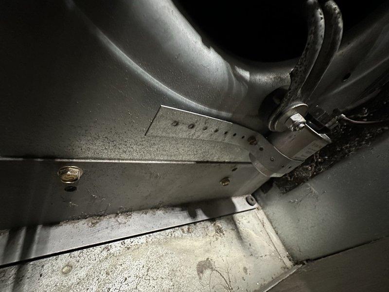 Completed comprehensive cleaning and servicing of 1999 Armstrong oil heating system. During inspection, identified elevated flue temperatures indicating potential soot buildup or oversized nozzle requiring monitoring and possible downsizing. Documented system performance with electrical readings showing 642mA and photographed ductwork connections; recommended fall follow-up to assess combustion efficiency and determine if nozzle adjustment is necessary.