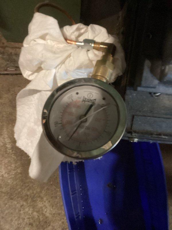 Completed comprehensive oil cleaning and maintenance service on New Yorker oil boiler system. Performed standard tune-up procedures including combustion chamber inspection, burner nozzle replacement, oil filter change, and system pressure testing as evidenced by gauge readings. All components operating within manufacturer specifications upon completion.