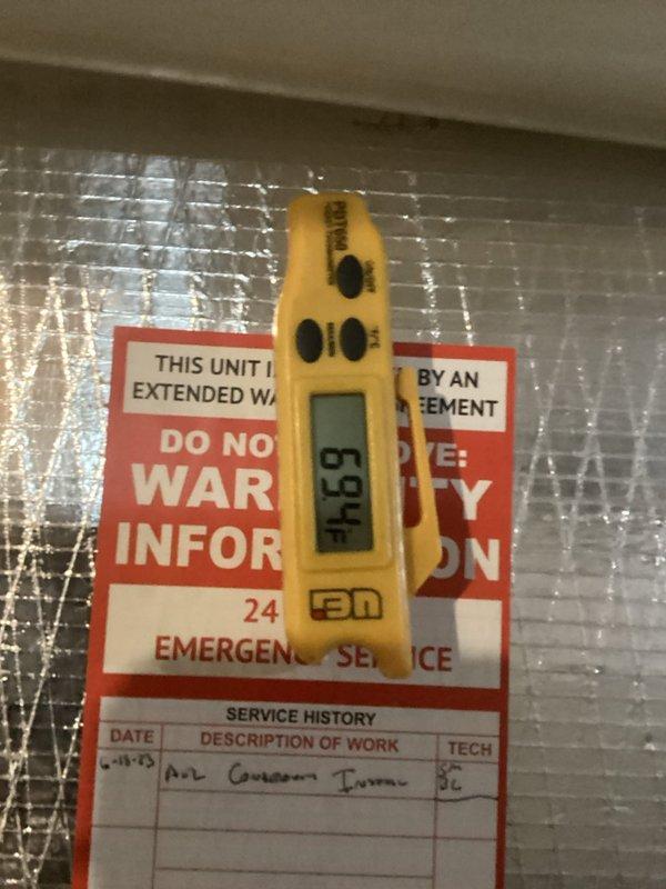 Performed seasonal maintenance on the Daikin air conditioning system and the York natural gas heating system. Inspected and tested system operation, and verified supply and return air temperatures with a digital thermometer (69.4°F and 50.7°F readings), indicating proper cooling performance and airflow. Confirmed the foil-faced ductwork and sealed joints were intact and the service tag was updated, with both systems operating normally at completion.
