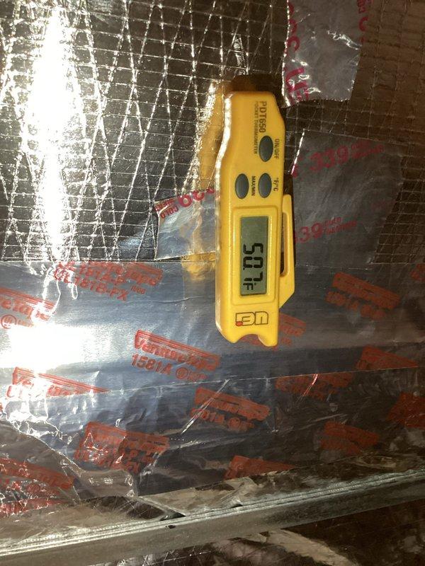 Performed seasonal maintenance on the Daikin air conditioning system and the York natural gas heating system. Inspected and tested system operation, and verified supply and return air temperatures with a digital thermometer (69.4°F and 50.7°F readings), indicating proper cooling performance and airflow. Confirmed the foil-faced ductwork and sealed joints were intact and the service tag was updated, with both systems operating normally at completion.