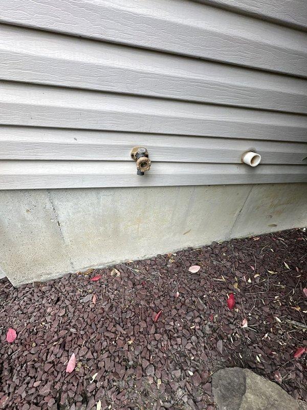 Repaired two leaking outdoor hose bibs: serviced the rear exterior hose bib that was leaking behind the siding, and rebuilt the leaking garage hose bib using the customer-supplied rebuild kit. Inspected the supply lines and expansion tank in the mechanical space, and no additional leaks, rust, or cracking were observed.