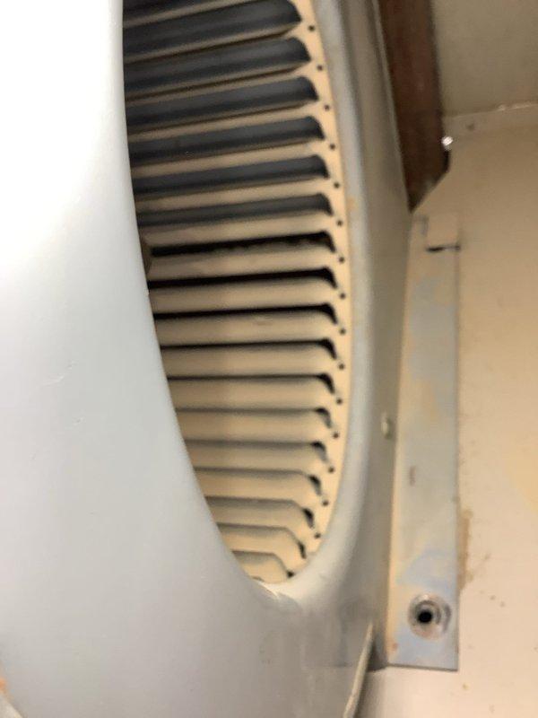 Performed annual cleaning and service on a 45-year-old Miller oil-fired furnace, including removal and cleaning of the burner assembly and replacement of the nozzle with a .60 x 80B. Inspected the blower compartment and squirrel cage wheel, noting dust accumulation on the blades and surface rust on the cabinet mounting bracket.