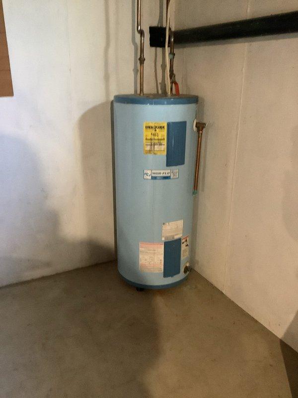 Replaced the existing water heater with a new Bradford White unit, reconnecting the hot and cold supply lines with copper piping and ball isolation valves, and routing the flue and discharge piping to code. Also replaced the basement shutoff valve serving the exterior hose spigot to restore proper isolation and operation.