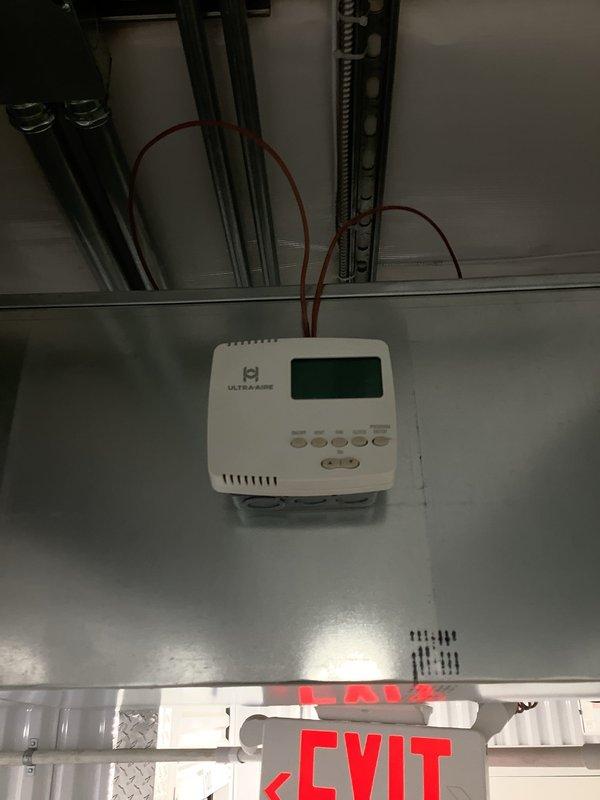 Replaced the failed Ultra-Aire dehumidifier/ventilation system controller, which was damaged by a power surge, with the new unit. Mounted the controller on the existing junction box at the ductwork, reconnected the control wiring, and verified the display powered up and the system responded to commands.