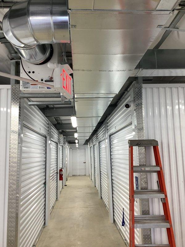 Replaced the failed Ultra-Aire dehumidifier/ventilation system controller, which was damaged by a power surge, with the new unit. Mounted the controller on the existing junction box at the ductwork, reconnected the control wiring, and verified the display powered up and the system responded to commands.