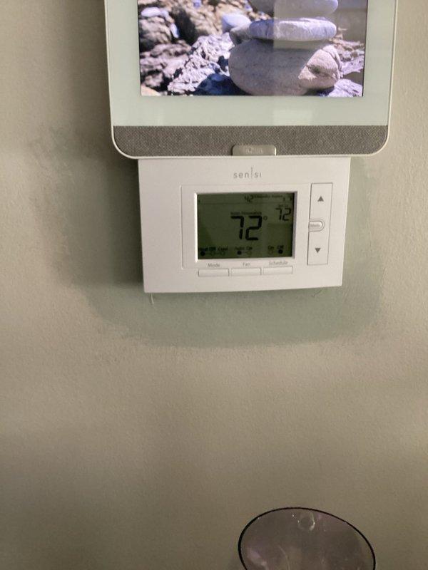 Performed a complete gas furnace tune-up on an existing Carrier unit, including removal of the front access panel and inspection of the burner assembly, gas valve and piping, inducer/draft blower, blower motor, wiring harness, and PVC venting and drain connections. Verified thermostat operation, and found the system operating normally with no deficiencies. Noted light dust accumulation and minor rust-colored staining near the blower drain fitting, which should be monitored at future maintenance visits.