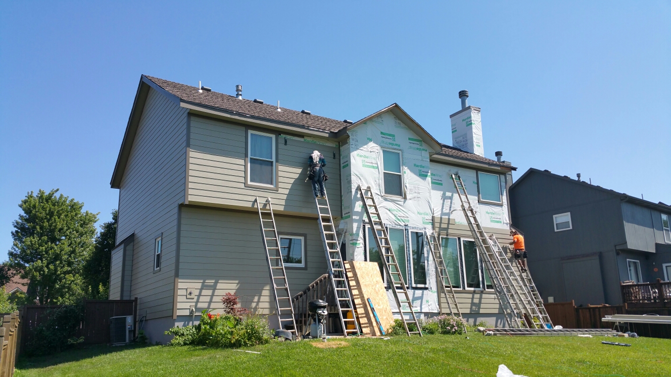 Olathe, KS - James Hardie ColorPlus Plank in Monterey Taupe and HardieTrim in Timberbark. New composition roof from GAF. Olathe, KS - James Hardie ColorPlus Plank in Monterey Taupe and HardieTrim in Timberbark. New composition roof from GAF.