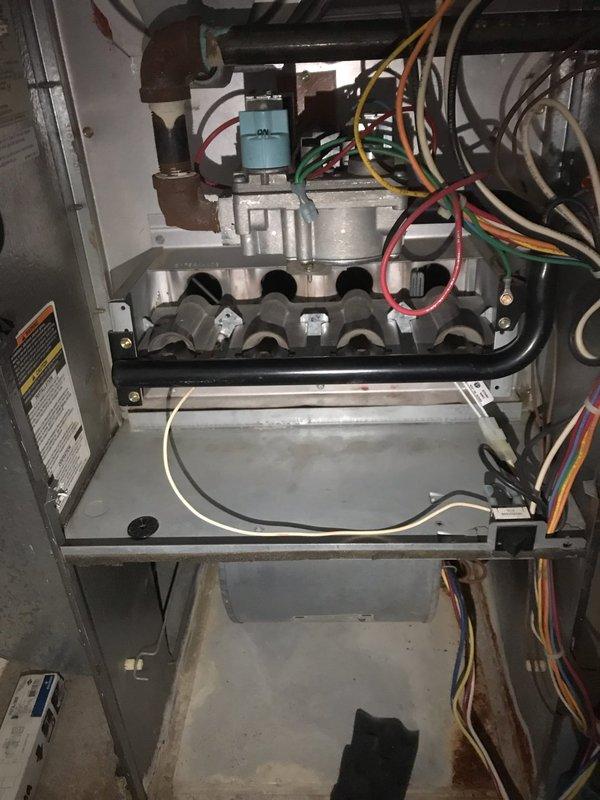 Responded to emergency no-heat call for a gas furnace with igniter failure. Upon inspection of the 25-year-old unit, observed significant dust accumulation and minor corrosion on the heat exchanger and burner assembly. Replaced faulty igniter, cleaned critical components, and verified proper system operation before completing service.