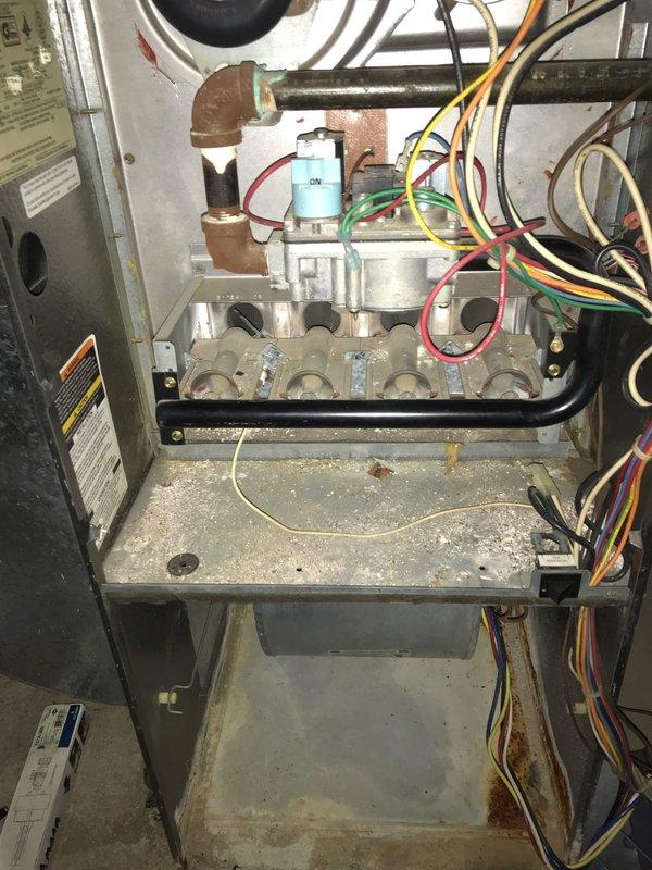 Responded to emergency no-heat call for a gas furnace with igniter failure. Upon inspection of the 25-year-old unit, observed significant dust accumulation and minor corrosion on the heat exchanger and burner assembly. Replaced faulty igniter, cleaned critical components, and verified proper system operation before completing service.