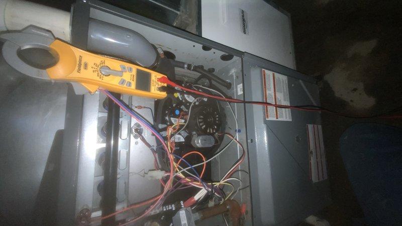 Responded to emergency no-heat call where basement flooding had affected furnace operation and caused water heater shutdown. Performed electrical diagnostics on furnace using clamp meter to test components and identified water damage to control board. Restored system functionality after water extraction and component replacement, ensuring safe operation of both heating system and water heater.