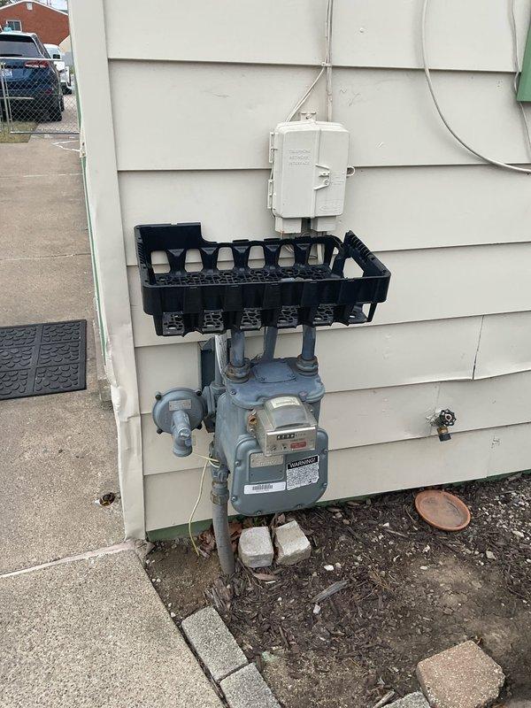 Performed system inspection and documentation for CQ Quote 03536-05, identifying existing electrical panel configuration and gas meter setup for HVAC replacement assessment. Documented current breaker panel capacity and gas meter installation to determine compatibility with proposed replacement system.