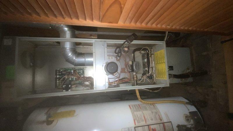 Diagnosed furnace in attic installation showing no heat condition. Inspection of circuit board revealed failed inducer motor preventing proper ignition sequence. Replaced inducer assembly, verified proper operation through complete heating cycle, and confirmed system is now functioning correctly with normal flame pattern and temperature rise.