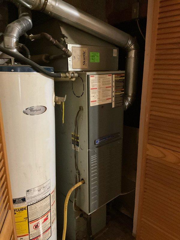 Conducted comprehensive assessment of existing HVAC system, including a Whirlpool water heater and furnace unit with associated ductwork and gas connections housed in utility closet. Evaluated potential replacement options for both heating system and water heater (including tankless alternatives), documenting current installation configuration and space constraints for proper system sizing and compatibility recommendations.