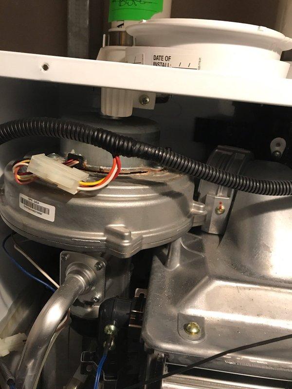 Diagnosed non-functioning Navien tankless water heater system. Inspected condensing heat exchanger and internal components, noting digital display readings of 188. Resolved operational issues and verified proper system functionality before completing service.