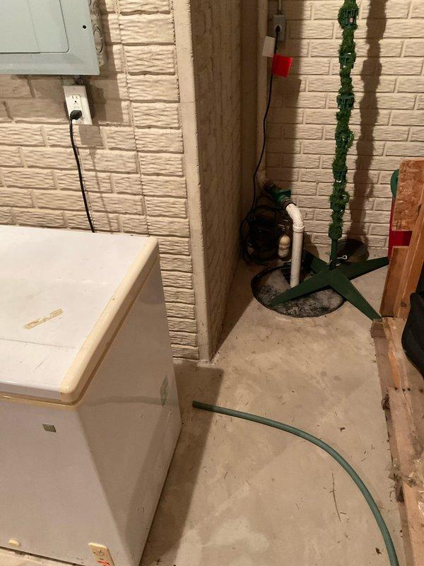 Conducted assessment of existing HVAC system including an aging Goodman air conditioning unit (model CAPP4960C5AA) and furnace for replacement estimate. Evaluated basement utility area configuration, noting existing drain access and electrical connections that will factor into new system installation. Quote reference CQ 03539-02/05 prepared for complete furnace replacement.
