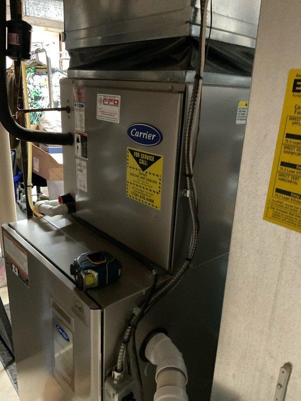 Performed inspection of existing Carrier HVAC system in utility room and provided multiple equipment replacement options including Lennox Merit and Elite lines. Customer expressed interest in mid-grade system with extended warranty coverage (10/10) and requested expedited installation. Discussed comparative advantages over competitor brands (Amana) and documented current system configuration for proper sizing of replacement unit.