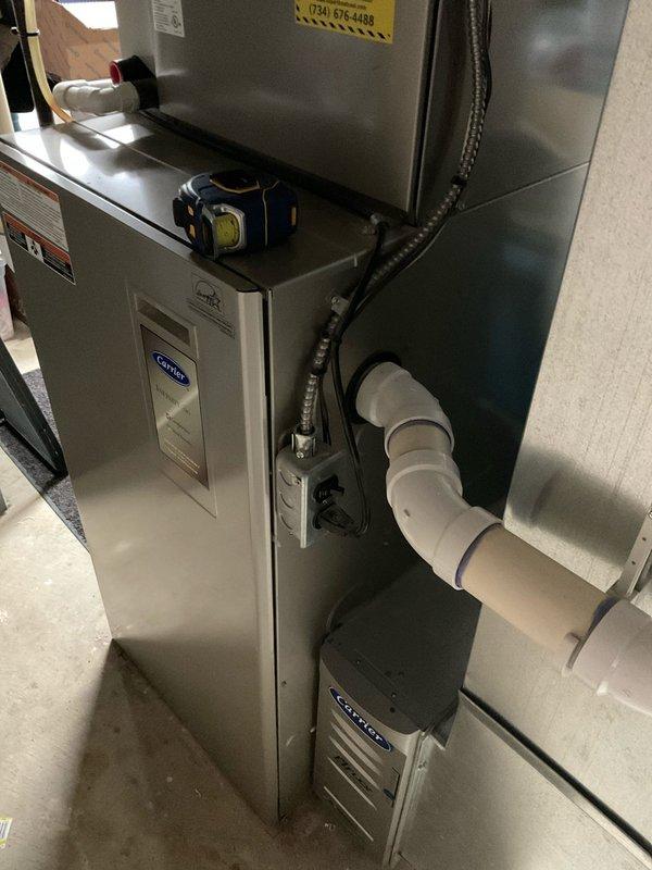 Performed inspection of existing Carrier HVAC system in utility room and provided multiple equipment replacement options including Lennox Merit and Elite lines. Customer expressed interest in mid-grade system with extended warranty coverage (10/10) and requested expedited installation. Discussed comparative advantages over competitor brands (Amana) and documented current system configuration for proper sizing of replacement unit.