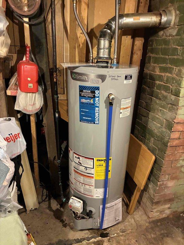 Successfully installed a new A.O. Smith 100-gallon tank water heater in the basement utility area, replacing the previous unit. Connected all necessary plumbing with PEX supply lines and properly vented the system through existing metal ductwork. Unit was tested for proper operation and meets all current energy efficiency standards.