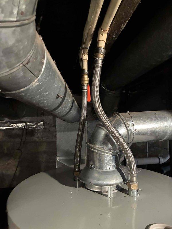 Successfully installed a new Bradford White tanked water heater in the utility area, complete with proper connection of all supply lines, discharge piping, and gas fittings. Verified proper operation of temperature control valve and conducted final inspection to ensure all connections were secure with no leaks present.