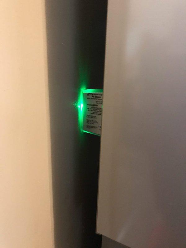 Responded to callback for surge protector showing red indicator light following recent power outage. Inspected Intermatic surge protection device in electrical panel and confirmed alarm status. Reset protection system and verified proper operation with green indicator light now showing normal function.
