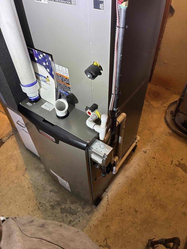 Successfully installed a 90,000 BTU furnace with proper venting, copper line connections, and essential control valves in the utility area. Completed interior components installation including humidifier and necessary plumbing infrastructure with ball valve shutoffs, while scheduling the 3-ton condenser installation and system startup to coincide with electrical service upgrade. Client received comprehensive education on S40 thermostat and humidifier operation.