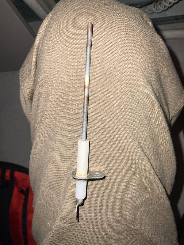 Performed scheduled maintenance on club AC8-12 unit, including inspection of the igniter component which showed signs of wear with visible discoloration on the metallic rod. Examined blower wheel assembly, noting proper fin alignment and confirming central hub integrity. Documented all components with photos for service record.