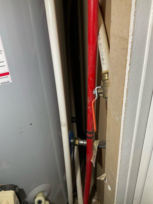 Diagnosed and replaced a malfunctioning tanked water heater that was producing inadequate heating and discharging gray-colored water. Installed new unit with proper connections to existing hot water line and PVC ventilation system, ensuring proper sealing at wall penetrations and verifying all fittings were secure with no leaks upon system restart.