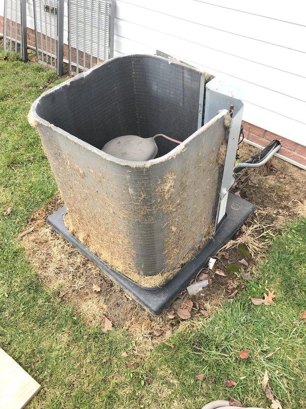 Conducted routine maintenance on Club AC12-4 unit. Performed visual inspection of outdoor condenser unit revealing significant dust accumulation on coils and debris in bottom pan area. System appears operational with normal wear; cleaned accessible components and verified proper refrigerant line connections.